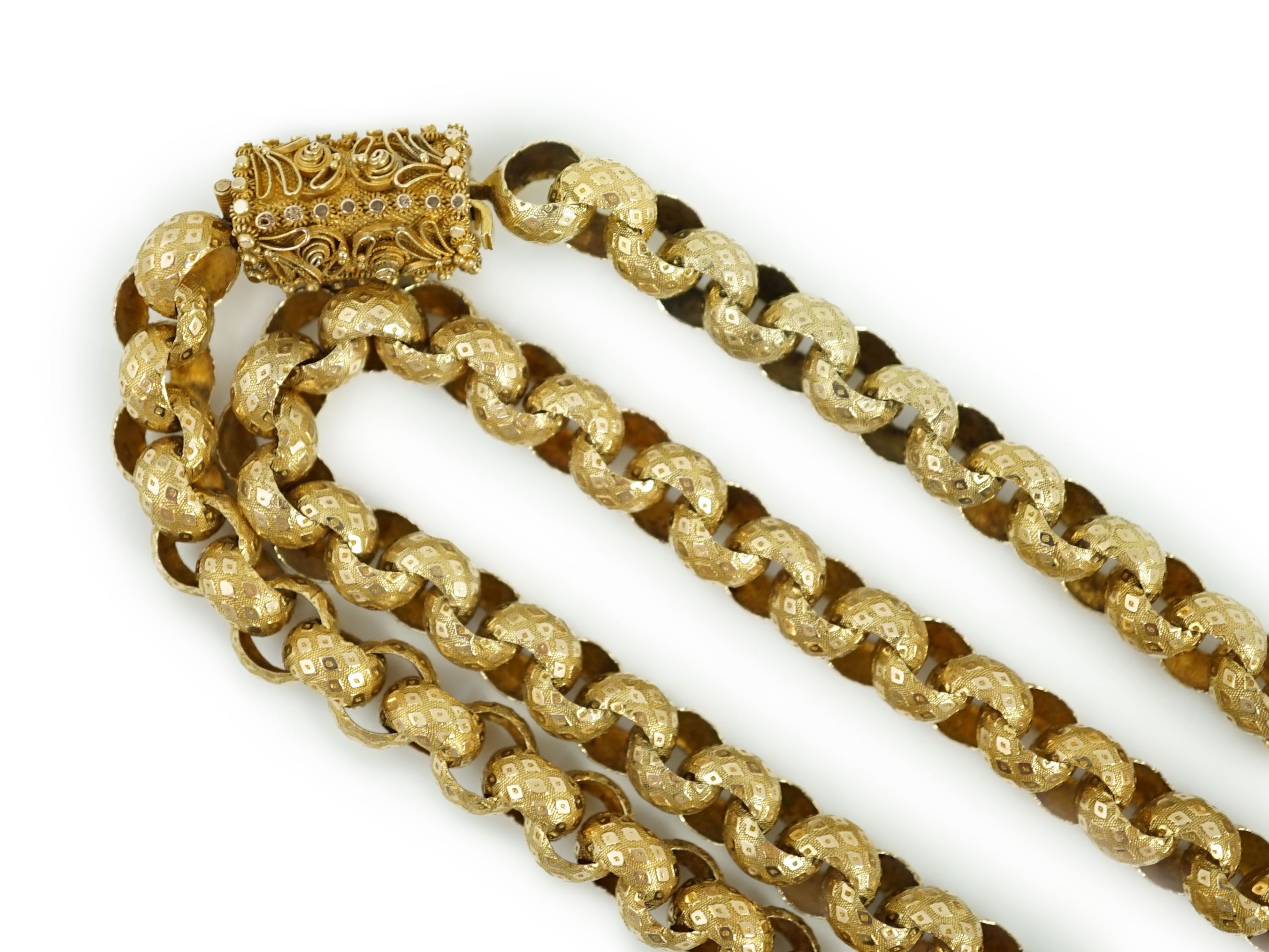 An early 19th century gold muff chain